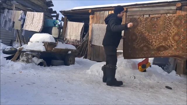 Выбивание пыли из ковров