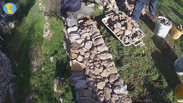 Retaining wall made of wild stone. Dry masonry.