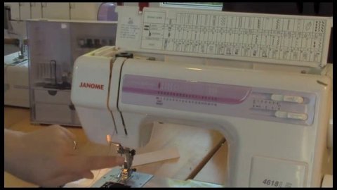 Sass threads a sewing machine