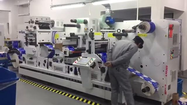 RHYGUAN PLUS-330 ROLL TO ROLL LABEL FINISHING SOLUTION