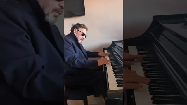 John McAfee playing the piano. September 2021