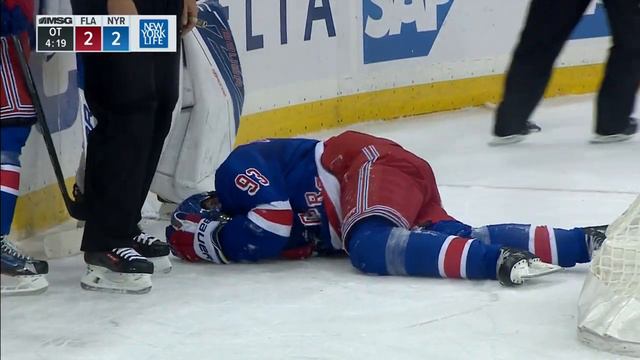 Zibanejad injured sliding hard into end boards feet first