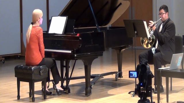 Horn and piano performance.