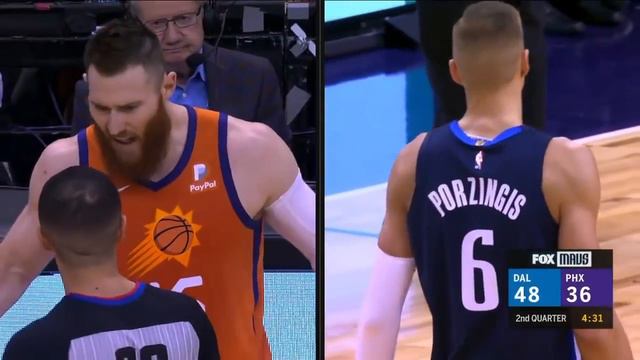 Kristaps Porzingis fights Aron Baynes