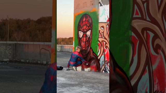 Spiderman draws graffiti