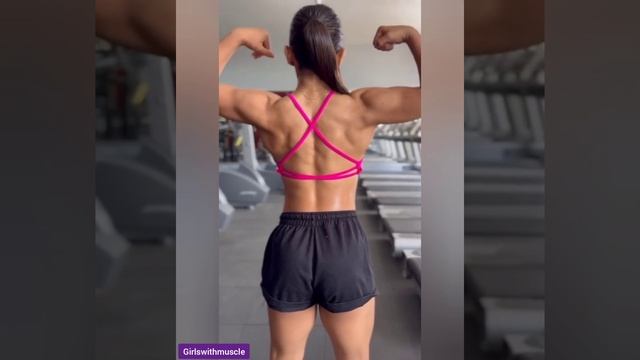 Beautiful muscle girl flexing