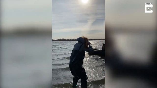 Rescued Brown Bear Goes Fishing With Owner