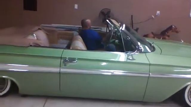 1962 impala ss with candy apple green color.