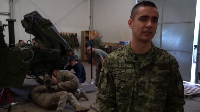 NATO BG-P Soldiers perform maintenance on a HMMWV