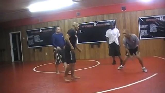 Kamal Shalorus teaching wrestlers how to combat jiu jitsu fighters
