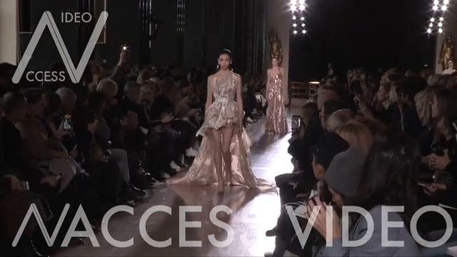 Models and designer on the runway for the Elie Saab HC Fashion Show