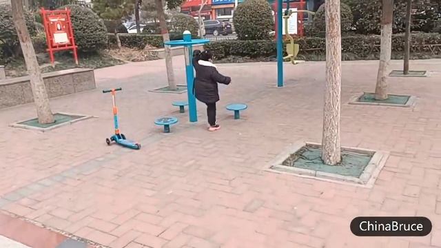 Happy new year 2023! My dad and I playing with my daughter at the clock square in China.