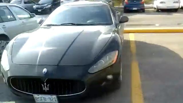 Black Maserati granturismo parked at Winners