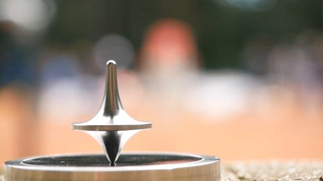 #15 One Moment Focussing - Child on Tennis Court - Spinning Top