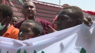 jono and his sudanese friends celebrate 100 years of apple picking