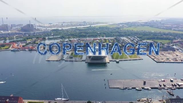 Inscription on video. Copenhagen, Denmark. Copenhagen Opera House. Blue lights form luminous. Elect