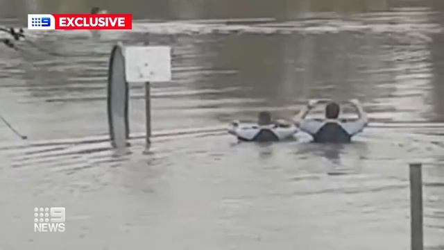 NSW Police brave rising floodwaters to save trapped man | 9 News Australia
