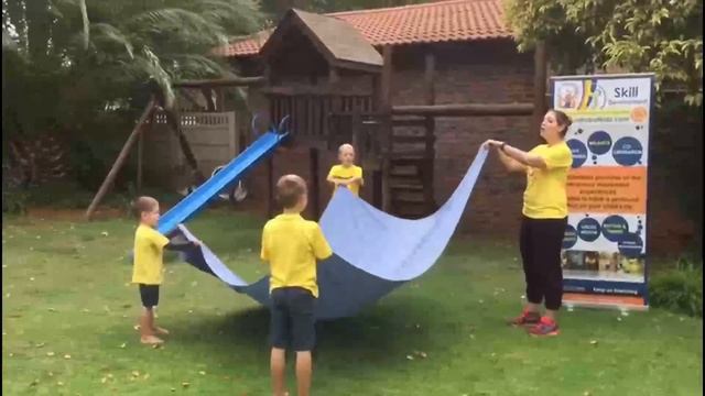 Catrobatkidz@Home with Anske demonstrating parachute activities for preschool children