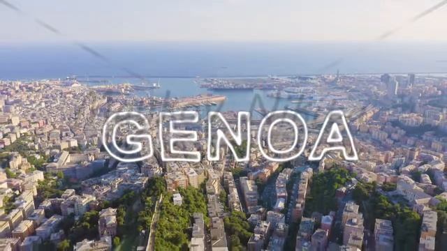 Inscription on video. Genoa, Italy. Central part of the city, aerial view. Ships in the port. Neon