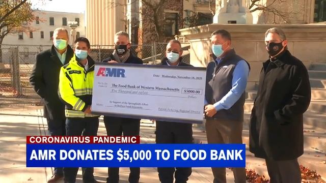 AMR presents check to Food Bank of Western Mass.