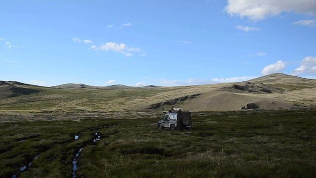 Travel on the shore of lake Khindictig-Khol in Tuva (Russia) on the Land Rover Defendef 90