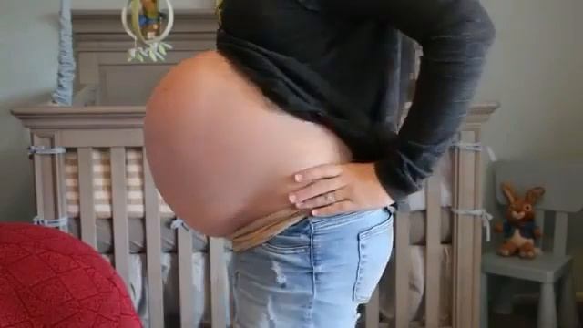 Huge Pregnant Girl Shows off her Huge Belly