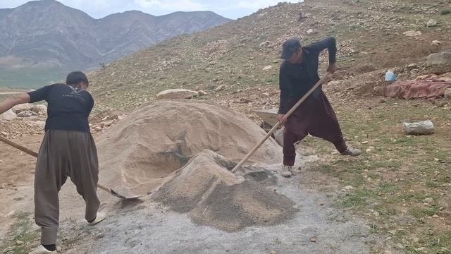 Mohammad and Narges efforts to build a house: bringing sand.