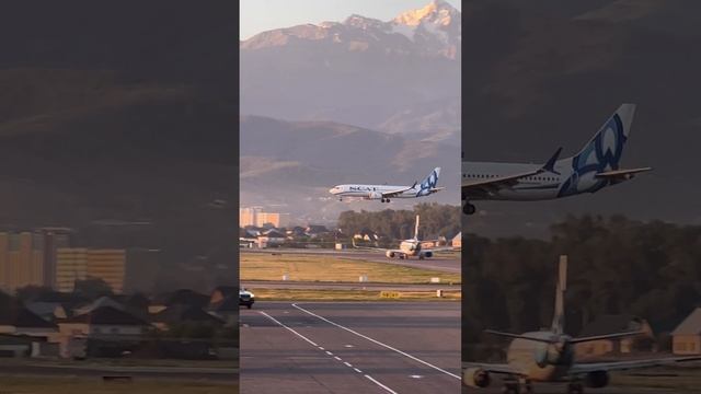 Посадка самолета на фоне гор/Plane landing on the background of mountains