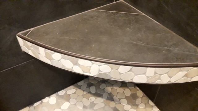 Curved floating corner bench