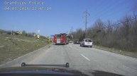 Officer Leaps to Rescue After Fleeing Suspect Rolls Over Vehicle