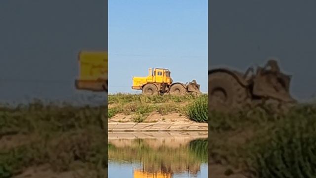 Large tractor K 700 drives along the road