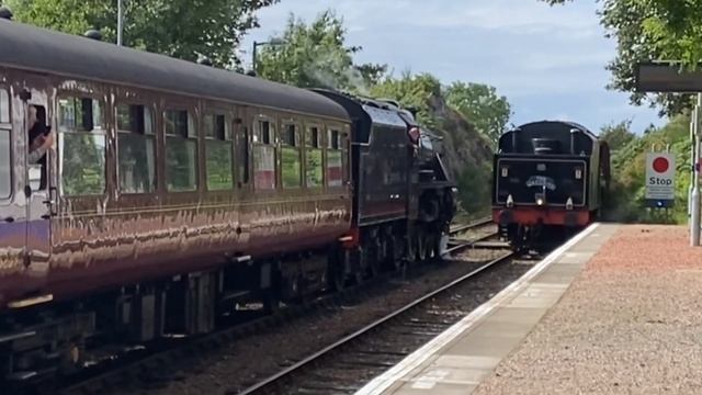 Two Jacobite steam trains stopping at Arisaig station