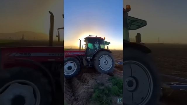 Трактор пашет вдоль дороги