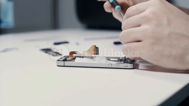 videoblocks smart phone repairing with screwdriver at service center close up hudgxadcu  84d24c51a35