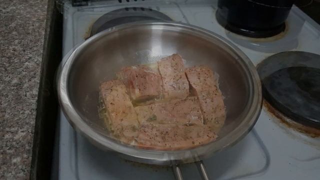 Salmon seared w/ lemon, butter and oregano.
