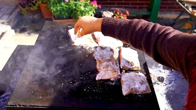 Big Fish Fried on a Stone. Grilled Fish and Samovar Tea