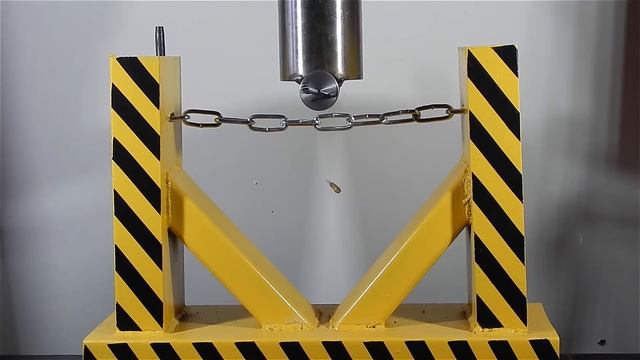 HYDRAULIC PRESS AGAINST CHAIN