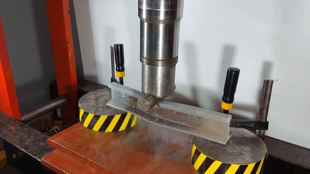 HYDRAULIC PRESS AGAINST RAILWAY RAIL FROZEN IN LIQUID NITROGEN