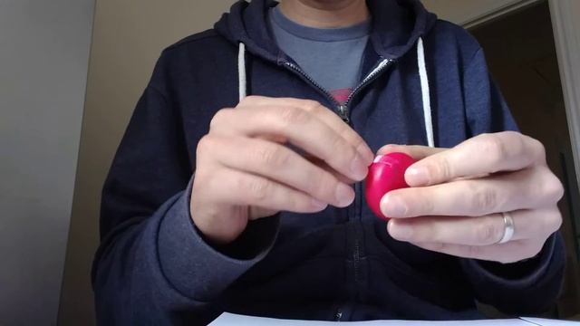 Opening a Babybel without splitting it in half.