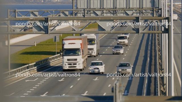 several trucks and cars driving on the highway. Saint-Petersburg, Russia, 2016