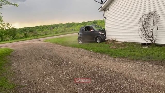 Smart car drives into corner of house