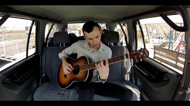 Small guitar piece in the backseat of a car