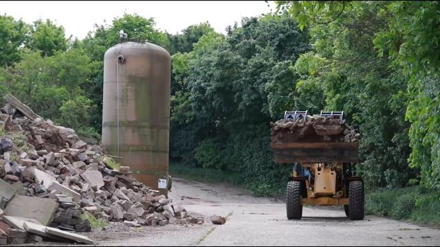908 High Lift with Industrial Grapple Bucket at Work | Next Generation Cat® Compact Wheel Loaders