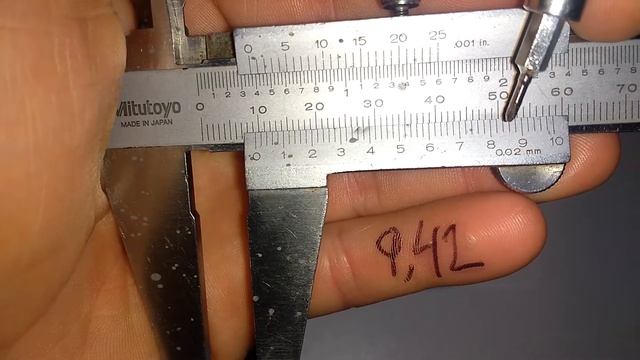 Medir en mm con pie de rey precisión 0.02 mm