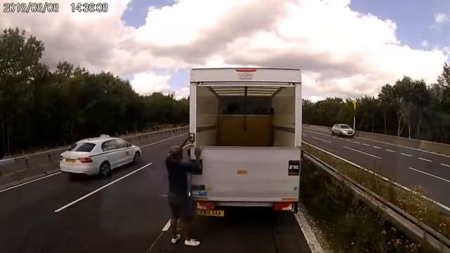 van with tail-lift down on motorway