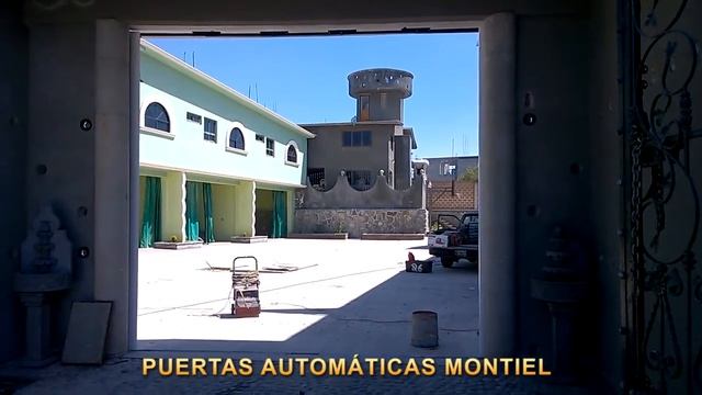 Puerta automática corrediza de 2 hojas tipo americano con motor de cadena