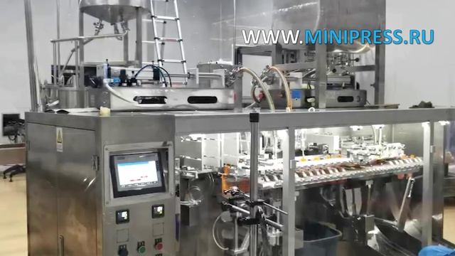 Автоматическая машина розлива жидкостей в дой-пак пакеты DG-18 Minipress.ru