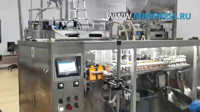 Автоматическая машина розлива жидкостей в дой-пак пакеты DG-18-2 Minipress.ru