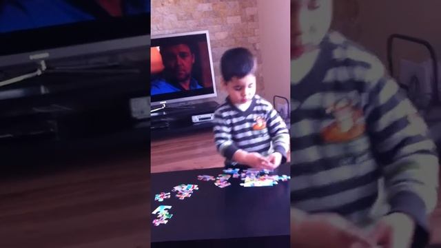 Smart brother makes a puzzle