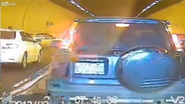 Flat tire causes car to loose control at tunnel entrance and flip after hitting another vehicle